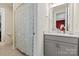 Bright bathroom with a gray vanity, quartz countertop, and a shower with decorative curtain at 7118 Overjoyed Xing, Charlotte, NC 28215