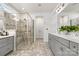 Bathroom with double sink vanity, a glass enclosed shower and natural light at 7118 Overjoyed Xing, Charlotte, NC 28215