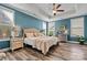 Cozy bedroom features a tray ceiling, a ceiling fan and lots of natural light at 7118 Overjoyed Xing, Charlotte, NC 28215