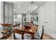 Open concept dining room and kitchen with hardwood floors and views of a comfortable living room at 7118 Overjoyed Xing, Charlotte, NC 28215