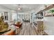 Spacious living room with hardwood floors, elegant decor, and plenty of natural light at 7118 Overjoyed Xing, Charlotte, NC 28215