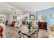 Open-concept living room showcases wood floors, lots of natural light and open access to kitchen at 7118 Overjoyed Xing, Charlotte, NC 28215