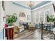 Elegant sitting room with large windows providing natural light, patterned chairs, and blue accents at 7118 Overjoyed Xing, Charlotte, NC 28215