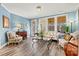 Bright living room boasts a cozy seating arrangement, large windows, and a charming ambiance at 7118 Overjoyed Xing, Charlotte, NC 28215