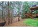 Enjoy the privacy of this home's backyard with a multilevel deck surrounded by mature trees and natural landscape at 722 Fairway Point Dr, Fort Mill, SC 29708