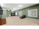 Finished basement with windows, shelving, seating and carpeted flooring at 722 Fairway Point Dr, Fort Mill, SC 29708