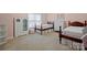 Charming bedroom features two beds, window, and a lovely display cabinet at 722 Fairway Point Dr, Fort Mill, SC 29708