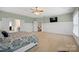 Large bedroom features a trey ceiling and a wall mounted television at 722 Fairway Point Dr, Fort Mill, SC 29708