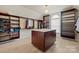 Extensive walk-in closet featuring custom shelving and a center island at 722 Fairway Point Dr, Fort Mill, SC 29708