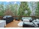 Relax on this spacious deck featuring modern outdoor furniture and a grill perfect for outdoor entertaining at 722 Fairway Point Dr, Fort Mill, SC 29708