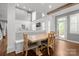 Sunlit dining area with gray walls, custom trim work and a stylish wooden dining table at 722 Fairway Point Dr, Fort Mill, SC 29708