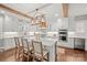 Bright kitchen features large center island with seating, custom cabinets, and stainless appliances at 722 Fairway Point Dr, Fort Mill, SC 29708