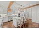Well-appointed white kitchen with large island, stainless steel appliances, and custom backsplash at 722 Fairway Point Dr, Fort Mill, SC 29708