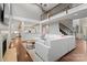 Open-concept living room with high ceilings, fireplace, and a view to the kitchen and upper level at 722 Fairway Point Dr, Fort Mill, SC 29708