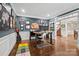 Well-lit home office with built-ins, hardwood floors, and a view to the foyer and staircase at 722 Fairway Point Dr, Fort Mill, SC 29708
