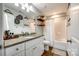 Well-lit bathroom featuring modern fixtures, bathtub with shower, and wood-look flooring at 730 Shuttles Way, Fort Mill, SC 29715