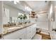 Bathroom featuring double sinks, granite countertops, a glass-enclosed shower, and wood-look flooring at 730 Shuttles Way, Fort Mill, SC 29715
