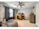 This bedroom boasts a comfy beanbag, neutral walls, and lots of natural light at 730 Shuttles Way, Fort Mill, SC 29715