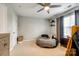 This bedroom features neutral walls and flooring, a modern ceiling fan, and natural lighting at 730 Shuttles Way, Fort Mill, SC 29715