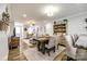 Elegant dining area with hardwood floors, an open layout, and stylish furnishings at 730 Shuttles Way, Fort Mill, SC 29715