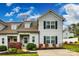 Charming two-story home with a well-manicured lawn, beautiful landscaping, and a private driveway at 730 Shuttles Way, Fort Mill, SC 29715