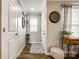 Bright hallway featuring hardwood floors, elegant decor, and access to multiple rooms at 730 Shuttles Way, Fort Mill, SC 29715