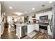 Open-concept kitchen with stainless steel appliances, hardwood floors, and plenty of natural light at 730 Shuttles Way, Fort Mill, SC 29715