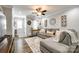 Bright living room with hardwood floors, a cozy sofa, and stylish decor elements at 730 Shuttles Way, Fort Mill, SC 29715
