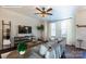 Inviting living room with hardwood floors, a cozy sofa, and abundant natural light at 8117 Jacey Ln # 42, Huntersville, NC 28078