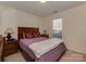 Cozy bedroom with natural light, neutral colors, and comfortable furnishings at 8527 Conner Ridge Ln, Charlotte, NC 28269