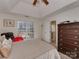 Spacious bedroom with a large window and a connecting door to the bathroom at 8527 Conner Ridge Ln, Charlotte, NC 28269