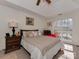 Bedroom with a large window, neutral colors, and a dark wood nightstand at 8527 Conner Ridge Ln, Charlotte, NC 28269
