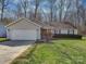 Charming single-story home with a well-maintained lawn, two-car garage, and inviting curb appeal at 8527 Conner Ridge Ln, Charlotte, NC 28269
