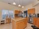 This kitchen offers stainless steel appliances, granite countertops and a central island at 8527 Conner Ridge Ln, Charlotte, NC 28269