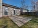 Spacious concrete patio extends from the house, leading to the backyard for outdoor entertaining and relaxation at 8527 Conner Ridge Ln, Charlotte, NC 28269