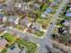 Aerial view of a home on a corner lot with lush green lawns in a residential neighborhood at 8941 Vickery Ln, Harrisburg, NC 28075