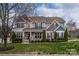 Charming two-story home with a well-manicured lawn and beautiful landscaping at 8941 Vickery Ln, Harrisburg, NC 28075