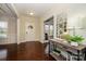 Welcoming foyer with hardwood floors, natural light, and decorative console table at 8941 Vickery Ln, Harrisburg, NC 28075
