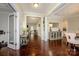 Open foyer with hardwood floors leading to dining and exercise rooms at 8941 Vickery Ln, Harrisburg, NC 28075