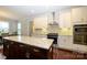 Well-equipped kitchen with granite countertops, stainless appliances, and ample cabinet space at 8941 Vickery Ln, Harrisburg, NC 28075