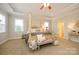 This main bedroom has tray ceiling and matching dressers on both sides of bed at 8941 Vickery Ln, Harrisburg, NC 28075