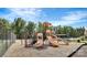 Community playground with slides and various play equipment for children to enjoy, surrounded by mature trees at 8941 Vickery Ln, Harrisburg, NC 28075