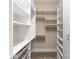 Walk-in closet with custom shelving and ample storage space with metal drawers at 917 Herrons Ferry Rd, Rock Hill, SC 29730
