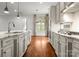 Bright, open kitchen with stainless steel appliances, granite countertops, hardwood floors, and a breakfast nook with natural light at 917 Herrons Ferry Rd, Rock Hill, SC 29730