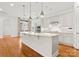 Bright kitchen with a large island, white cabinetry, and stainless steel appliances, perfect for cooking at 917 Herrons Ferry Rd, Rock Hill, SC 29730