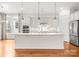 Stylish kitchen with a center island, stainless steel appliances, and ample cabinet space, ideal for culinary enthusiasts at 917 Herrons Ferry Rd, Rock Hill, SC 29730
