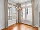 Bright kitchen nook area with modern chandelier, hardwood floors, neutral walls and exterior neighborhood views at 917 Herrons Ferry Rd, Rock Hill, SC 29730