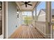 Relaxing screened porch with wood flooring, a ceiling fan, and views of the backyard at 917 Herrons Ferry Rd, Rock Hill, SC 29730
