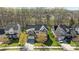 A high angle shows the home with a manicured lawn and mature trees at 10129 Loch Lomond Dr, Charlotte, NC 28278