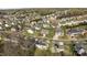 Neighborhood aerial view of the houses with mature trees in the yards at 10129 Loch Lomond Dr, Charlotte, NC 28278